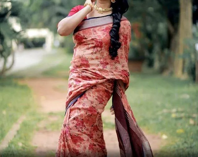Exceptional  Coral Colored  Festive Printed  Pure Linen Saree