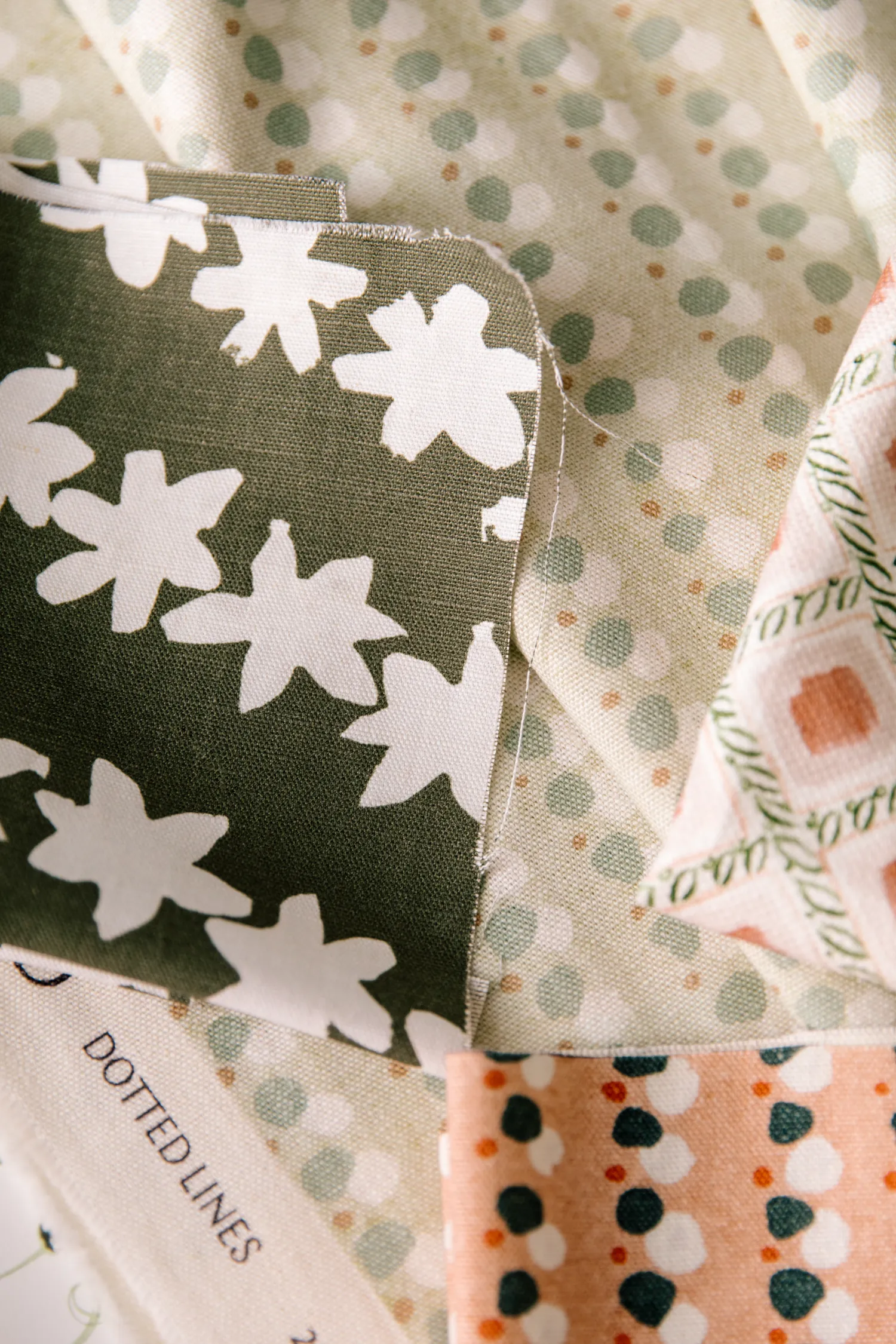 Stamped Garland Fabric in Dark Olive